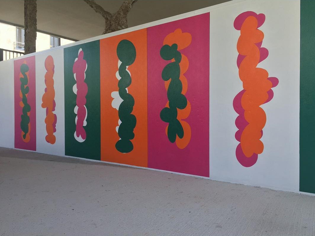 a colorful fresco in the simple environment of a public hospital